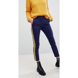 Cropped fitted trouser with racer stripe.